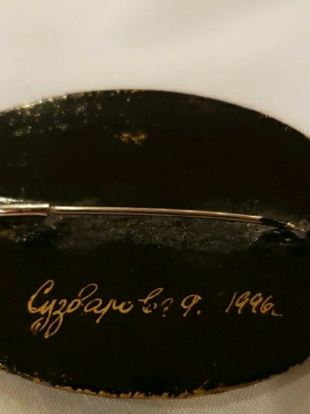 Vintage '96 Oval Black Floral Brooch with Gold Accents
